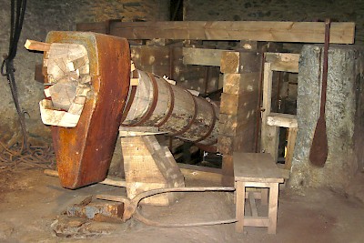 An iron foundry from the 18th century. The gigantic hammer used waterpower to shape iron products.