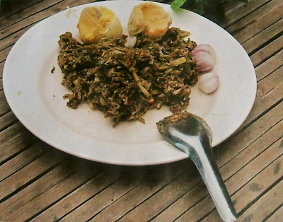 A mixture of iguana meat and greens, as well as two boiled iguana eggs. Note that the iguana eggs are all yolk and no white.