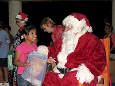 Chelem children enjoying a visit from Santa Claus in Yucatan